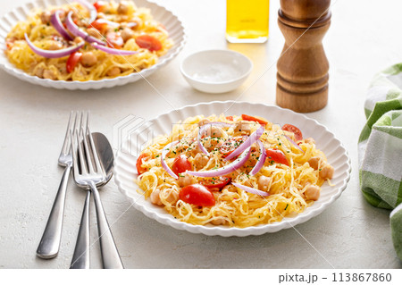 Spaghetti squash with chickpeas and tomatoes topped with red onion, low carb vegan recipe idea Spaghetti squash with chickpeas and tomatoes topped with red onion, low carb vegan recipe idea 113867860