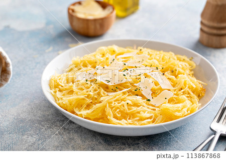 Spaghetti squash roasted and pulled apart served with olive oil and parmesan Spaghetti squash roasted and pulled apart served with olive oil and parmesan 113867868