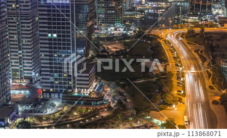 Jumeirah Lake Towers residential district aerial night timelapse near Dubai Marina Jumeirah Lake Towers residential district aerial night timelapse near Dubai Marina 113868071