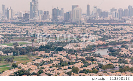 Aerial view of apartment houses and villas in Dubai city timelapse, United Arab Emirates Aerial view of apartment houses and villas in Dubai city timelapse, United Arab Emirates 113868118