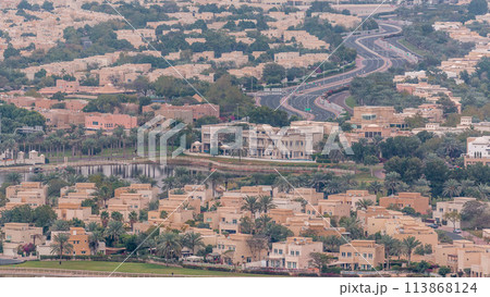 Aerial view of apartment houses and villas in Dubai city timelapse, United Arab Emirates Aerial view of apartment houses and villas in Dubai city timelapse, United Arab Emirates 113868124