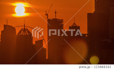 Dubai Marina skyscrapers from golf course sunset timelapse, Dubai, United Arab Emirates Dubai Marina skyscrapers from golf course sunset timelapse, Dubai, United Arab Emirates 113868181