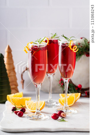 Christmas mimosas with cranberry juice and champagne or sparkling wine, festive Christmas cocktails Christmas mimosas with cranberry juice and champagne or sparkling wine, festive Christmas cocktails 113868243