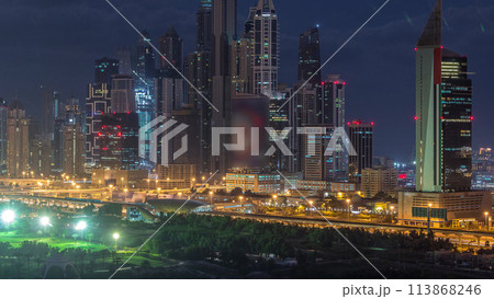 Dubai Marina skyscrapers and golf course night to day timelapse, Dubai, United Arab Emirates Dubai Marina skyscrapers and golf course night to day timelapse, Dubai, United Arab Emirates 113868246