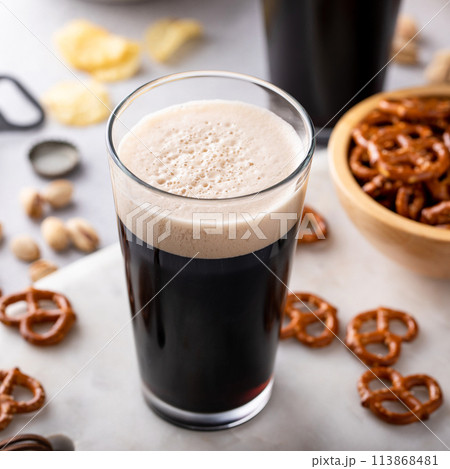 Dark stout beer in tall glasses on the table Dark stout beer in tall glasses on the table 113868481