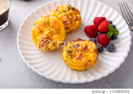 Breakfast egg muffins or egg bites with bacon and cheddar Breakfast egg muffins or egg bites with bacon and cheddar 113868501