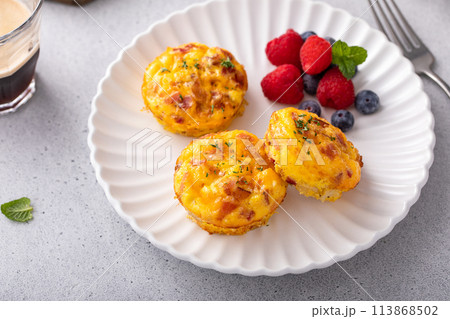 Breakfast egg muffins or egg bites with bacon and cheddar Breakfast egg muffins or egg bites with bacon and cheddar 113868502