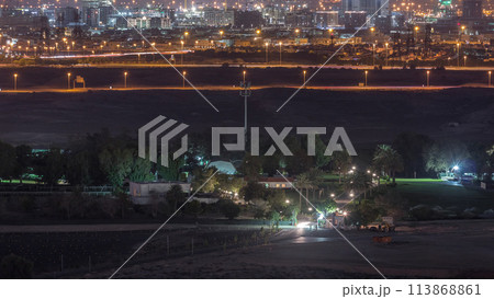 Aerial view to villas and houses near Golf course night timelapse 113868861