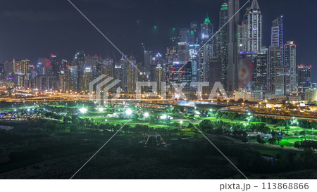 Dubai Marina skyscrapers and golf course night timelapse, Dubai, United Arab Emirates 113868866