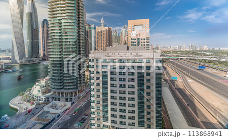 Aerial top view to Sheikh Zayed road near Dubai Marina timelapse, Dubai. 113868941