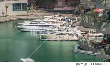 Waterfront promenade in Dubai Marina aerial timelapse. Dubai, United Arab Emirates 113868950