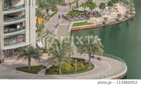 Waterfront promenade in Dubai Marina aerial timelapse. Dubai, United Arab Emirates 113868952