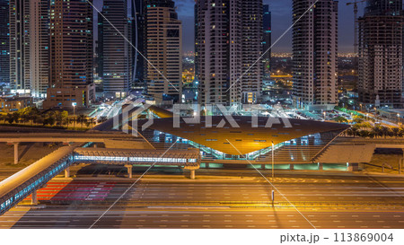 Aerial top view to Sheikh Zayed road near Dubai Marina and JLT night to day timelapse, Dubai. 113869004