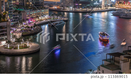 Waterfront promenade in Dubai Marina aerial night timelapse. Dubai, United Arab Emirates 113869015