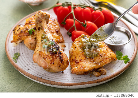 Roasted lemon and herb chicken drumsticks and thighs Roasted lemon and herb chicken drumsticks and thighs 113869040