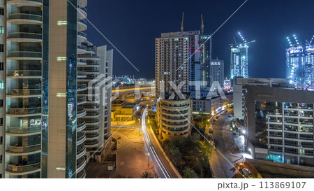 Dubai Marina skyscrapers and promenade aerial night to day timelapse, Dubai, United Arab Emirates Dubai Marina skyscrapers and promenade aerial night to day timelapse, Dubai, United Arab Emirates 113869107