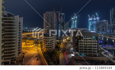 Dubai Marina skyscrapers and promenade aerial night to day timelapse, Dubai, United Arab Emirates 113869189