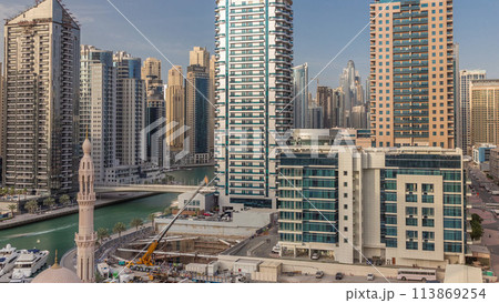Dubai Marina skyscrapers, port with luxury yachts and Marina promenade aerial timelapse, Dubai, United Arab Emirates Dubai Marina skyscrapers, port with luxury yachts and Marina promenade aerial timelapse, Dubai, United Arab Emirates 113869254