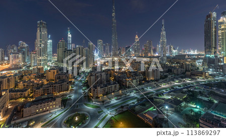 Dubai Downtown skyline night to day timelapse with Burj Khalifa and other towers panoramic view from the top in Dubai Dubai Downtown skyline night to day timelapse with Burj Khalifa and other towers panoramic view from the top in Dubai 113869297