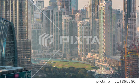 Dubai downtown during golden sunrise morning scene timelapse. 113869380