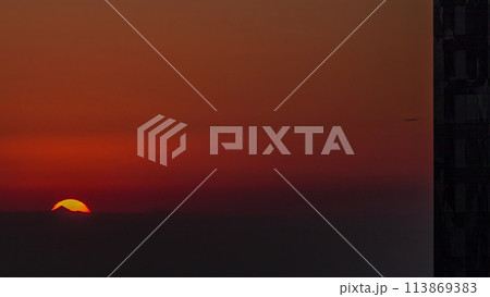 Sunrise close up view over Dubai skyline in the morning, aerial top view from downtown timelapse. Sunrise close up view over Dubai skyline in the morning, aerial top view from downtown timelapse. 113869383