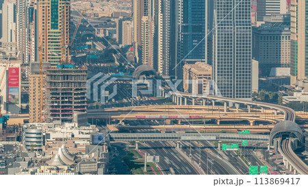 Skyscrapers on Sheikh Zayed Road and DIFC aerial timelapse in Dubai, UAE. 113869417