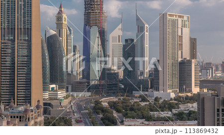 Skyline view of the buildings of Sheikh Zayed Road and DIFC timelapse in Dubai, UAE. 113869432