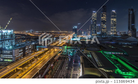 Aerial view of Financial center road night to day timelapse with under construction building 113869434