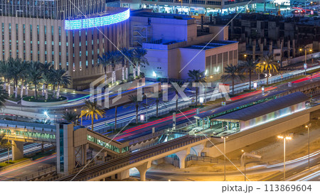 Aerial view of Dubai Tram in Dubai marina night timelapse. 113869604