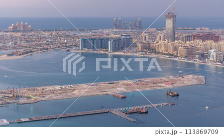 Aerial view of Palm Jumeirah Island day to night timelapse. 113869709