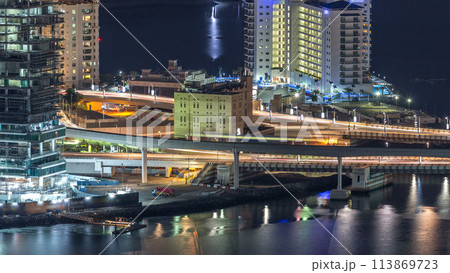 Aerial view of Palm Jumeirah Island night timelapse. 113869723