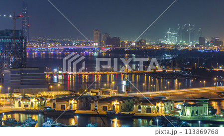 Dubai creek landscape night timelapse with boats and ship near waterfront Dubai creek landscape night timelapse with boats and ship near waterfront 113869768