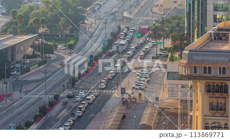 Dubai Creek area surrounded by modern buildings and busy traffic street timelapse Dubai Creek area surrounded by modern buildings and busy traffic street timelapse 113869771