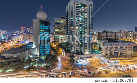 Dubai Creek area surrounded by modern buildings and busy traffic street night timelapse 113869791