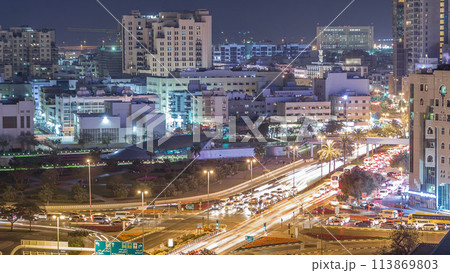 Dubai Creek area surrounded by modern buildings and busy traffic street night timelapse Dubai Creek area surrounded by modern buildings and busy traffic street night timelapse 113869803