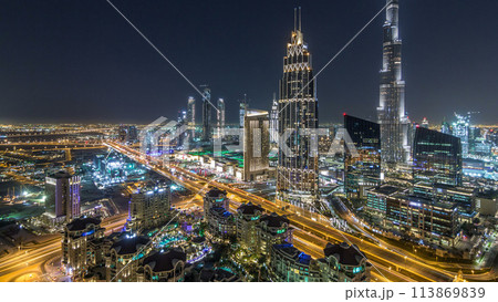 Dubai downtown skyline night timelapse with tallest building and road traffic, UAE 113869839