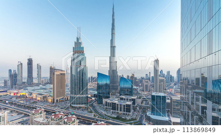 Dubai downtown skyline day to night timelapse with tallest building and Sheikh Zayed road traffic, UAE 113869849