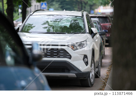 Cars parked in line on city street side. Urban traffic concept 113871466