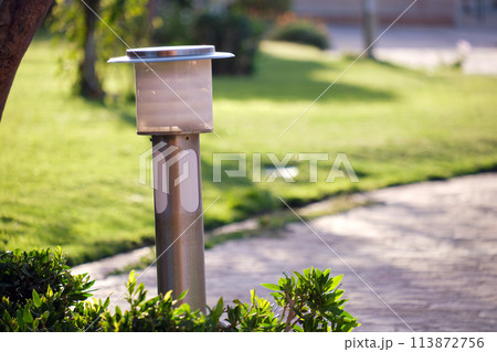 Outdoor lamp on yard lawn for garden lighting in summer park 113872756