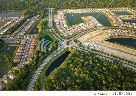 Ground prepared for building of new residential houses in Florida suburban development area. Concept of growing american suburbs Ground prepared for building of new residential houses in Florida suburban development area. Concept of growing american suburbs 113873555