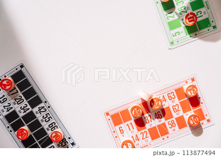 Lotto board game with red barrels and colorful cards Lotto board game with red barrels and colorful cards 113877494