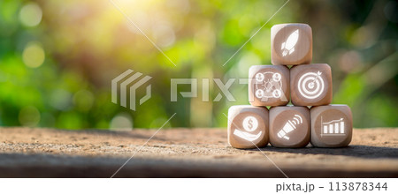 Crowdfunding concept, Wooden block on desk with startup, collaboration, target, investor, advertising and growth icon on virtual screen. 113878344