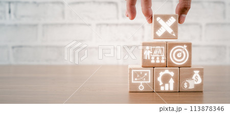 BPM, Business process management concept, Hand holding wooden block on desk with design, mentoring, goal, strategy, optimization and finance icon on virtual screen. 113878346
