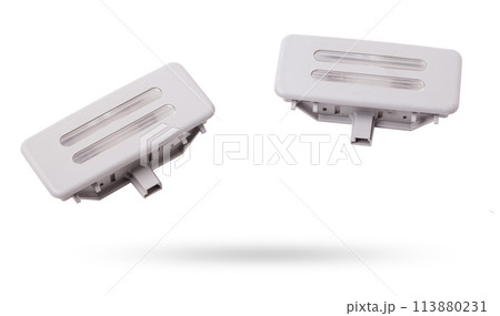 A transparent plastic shade for illuminating the interior on a white isolated background in a photo studio - spare parts for repairing a car interior or for sale in a auto service. A transparent plastic shade for illuminating the interior on a white isolated background in a photo studio - spare parts for repairing a car interior or for sale in a auto service. 113880231
