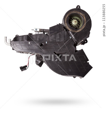 The body of the rear heater made of black plastic with an air conditioning system for repair and replacement on a car in a workshop on a white isolated background. Catalog of spare parts for vehicles 113880255