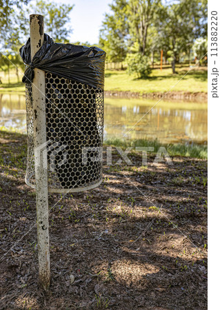 metal trash can with black plastic bag metal trash can with black plastic bag 113882220