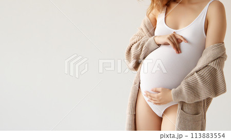 A beautiful pregnant girl in a white bodysuit and A beautiful pregnant girl in a white bodysuit and 113883554
