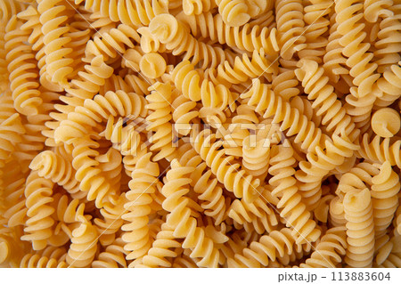 Fusilli pasta background macro view Fusilli pasta background macro view 113883604