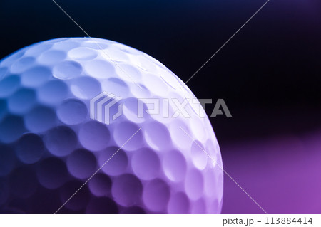 golf ball seen very close. Black background golf ball seen very close. Black background 113884414