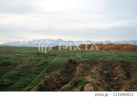 The Tatra Mountains are the highest part of the Carpathians, located in Slovakia and Poland, part of the Fatrans-Tatrans region. View from afar. Field, arable land The Tatra Mountains are the highest part of the Carpathians, located in Slovakia and Poland, part of the Fatrans-Tatrans region. View from afar. Field, arable land 113886822